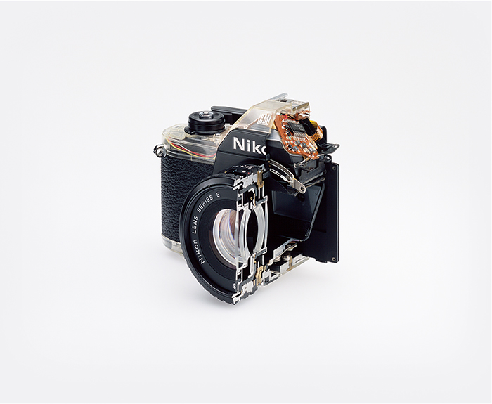 Christopher Williams, "Cutaway model Nikon EM. Shutter: / Electronically governed Seiko metal blade shutter vertical travel with speeds from 1/1000 to 1 second with a manual speed of 1/90th. / Meter: Center-weighted Silicon Photo Diode, ASA 25-1600 / EV2-18 (with ASA film and 1.8 lens) / Aperture Priority automatic exposure / Lens Mount: Nikon F mount, AI coupling (and later) only / Flash: Synchronization at 1/90 via hot shoe / Flash automation with Nikon SB-E or SB-10 flash units / Focusing: K type focusing screen, not user interchangeable, with 3mm diagonal split image rangefinder / Batteries: Two PX-76 or equivalent / Dimensions: 5.3 × 3.38 × 2.13 in. (135 × 86 × 54 mm), 16.2 oz (460g) / Photography by the Douglas M. Parker Studio, Glendale, California / September 9, 2007– September 13, 2007", 2008.